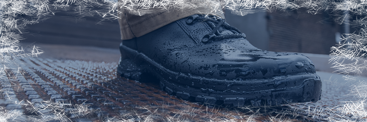 Waterproof boots category with the Enforce X High covered in water droplets on a metal surface and a frost border effect